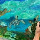 Artist Deborah Lightfield puts on finishing touches
